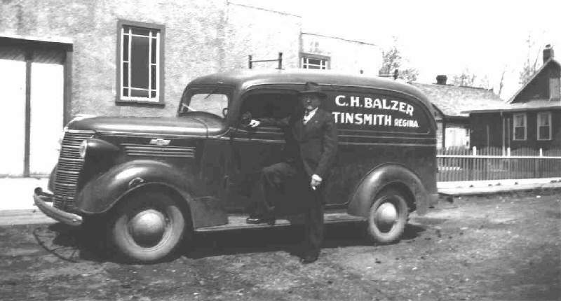 C.H. Balzer in 1937 beside the first company truck